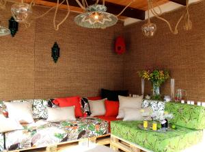 a living room with a couch and a table at Botanic Home in Marbella