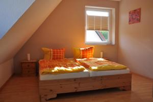 Ένα ή περισσότερα κρεβάτια σε δωμάτιο στο Ferienwohnung Landidyll