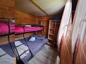 a small room with bunk beds in a house at Chalet pour 5 pers avec Terrasse - API-1-52-634 in Les Grandes-Ventes +12 photos
