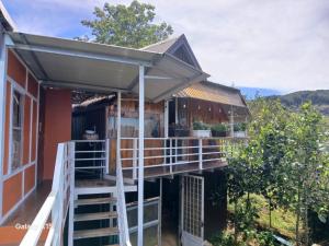 a house with a staircase leading to a porch at Homestay Đồi Sương Trắng in Da Lat +29 photos