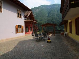 a patio with a table and chairs in a house at Holiday Home in Caldes near Ski Lift in Caldes