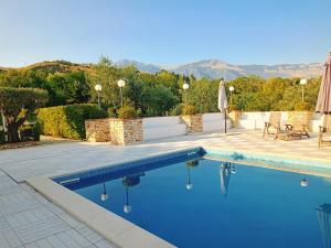 a swimming pool with a view of the mountains at Villa Giulia Castrovillari in Castrovillari