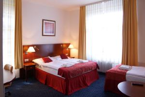 Letto o letti in una camera di Hotel Grand