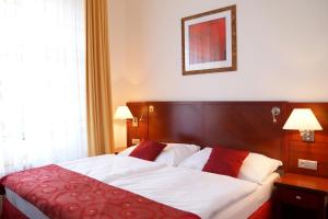 Letto o letti in una camera di Hotel Grand
