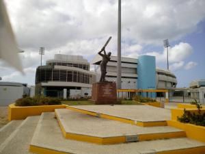 a statue of a baseball player holding a bat at Spacious Colonial in Bridgetown