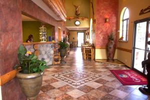 a lobby of a restaurant with a potted plant at Gateway Inn and Suites in Salida