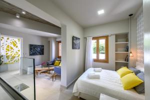 Postel nebo postele na pokoji v ubytování Candia Suites & Rooms