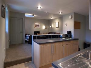 a kitchen with a sink and a counter top at Dunvegan Castle Laundry Cottage in Dunvegan