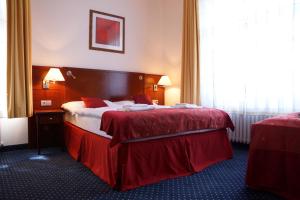 Letto o letti in una camera di Hotel Grand