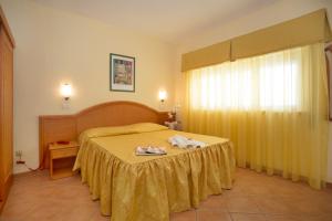 Posteľ alebo postele v izbe v ubytovaní Hotel Katy
