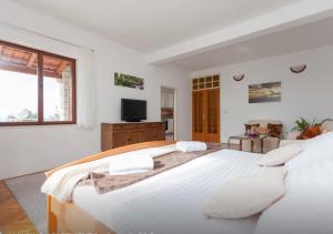 Posteľ alebo postele v izbe v ubytovaní Apartment and Rooms Villa Marijo