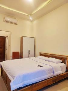Ένα ή περισσότερα κρεβάτια σε δωμάτιο στο Anymor Homestay