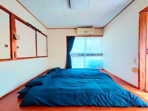 Giường trong phòng chung tại Minpaku Jaito-民泊じゃいと-Homestay in Traditional House