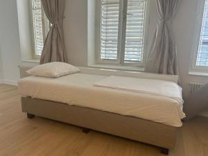 Ένα ή περισσότερα κρεβάτια σε δωμάτιο στο Central Charm Apartment, Geneva City Center