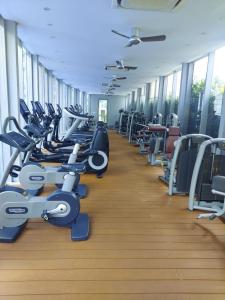 a large gym with rows of tread machines at Vortex Suites Dream By KL in Kuala Lumpur