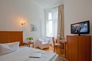 Postel nebo postele na pokoji v ubytování Hotel Brandies an der Messe