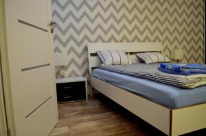 Posteľ alebo postele v izbe v ubytovaní Apartamenty Sailor i Comfort House Giżycko