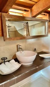 a bathroom with a white sink and a mirror at Casa en Tapalpa Cerca del Centro in Tapalpa