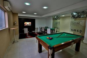 a billiard room with a pool table in a room at Monte Serrat Hotel in Santos