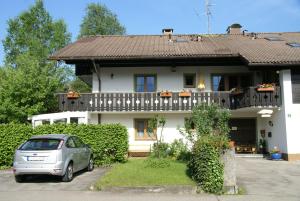 a small silver car parked in front of a house at Gästehaus Gaisalpe in Fischen