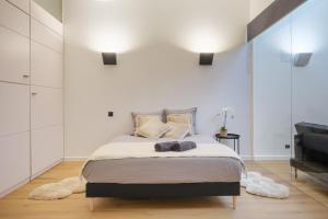 Katil atau katil-katil dalam bilik di 110 m2 loft-style apartment