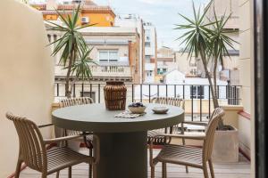 a table and chairs on a balcony with a view at C211 Barcelona - Simaba Group in Barcelona