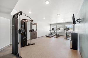 a gym with treadmills and machines in a room at WoodSpring Suites Jackson I-40 in Jackson