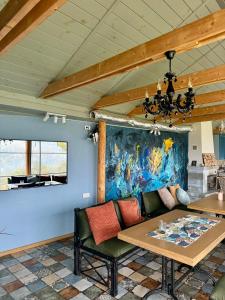 a dining room with a couch and a table at M.A.K.home in Vyshka +73 photos