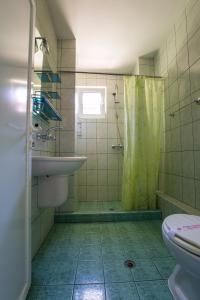 a bathroom with a shower and a sink and a toilet at Guest House ,, Ekaterina" in Nesebar +37 photos