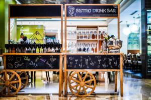 a bar with bottles of wine on top of it at Beijing Marriott Hotel Northeast in Beijing
