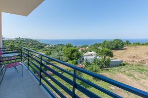 a balcony with a view of the ocean at 12 Olympian Gods in Platamonas