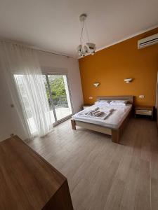 a bedroom with a bed and a large window at Villa Smokovac in Risan +86 photos