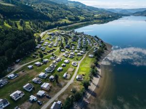 an aerial view of a parking lot next to a lake at Pluscamp Mageli in Bjørge