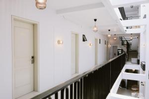 a hallway of a building with white walls and ceilings at ACHITEL Tarlac in Tarlac