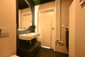 a bathroom with a sink and a mirror at Dluga Grobla 6 Apartments Oldtown in Gdańsk +67 photos