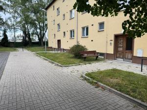 a building with a bench in front of it at Apartmán Dukla in Pardubice