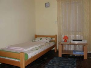 a small bedroom with a bed and a window at Country cottage in Konarevo