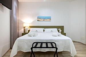 Una cama o camas en una habitación de Le camere Delù