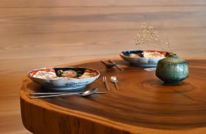 two bowls of food are sitting on a table at Koya Miyama in Nantan city