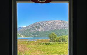 a view of a mountain from a window at Cozy Home In Elvegard With Sauna in Elvegård