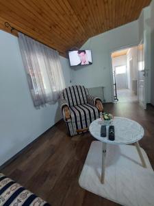 a living room with a couch and a table at Stari mlin - Old mill Šipovo in Šipovo