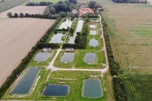 an aerial view of a field with several ponds at Monteurwohnung in Bruchhausen-Vilsen +5 photos