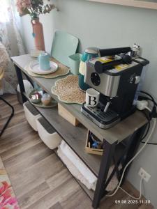 a table with a coffee maker on top of it at gemütliches Einzelzimmer von Privat, frisch renoviert in Brake Zwei