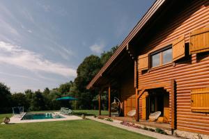 a house with a swimming pool next to a building at Gerês Nature House Piscina Privada Aquecida 8 Pessoas in Campo do Gerês