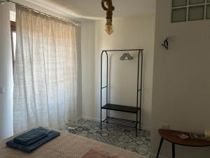 a bedroom with a bed with a mirror and a table at Casa Maria Antonia in Rapone
