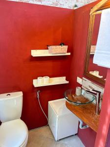 a bathroom with a toilet and a sink and a mirror at Villa Sunrise in Lucca +34 photos