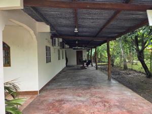 a hallway of a house with a wooden ceiling at Isabela house in Cañas +6 photos