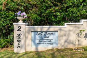 a sign for a wedding with a vase on top at Golf Beach and Sea in Southbroom
