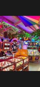 a candy store with a rainbow ceiling and some games at Dawbers Retreat in Selsey