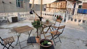 a patio with a table and chairs and an umbrella at Mook Seoul in Seoul